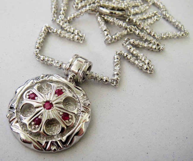 Polished Sterling Silver & Ruby Cross Pendant w/ : Polish sterling silver with inlay natural rubies round cross pendant with chain. Ends in a toggle clasp.w1122