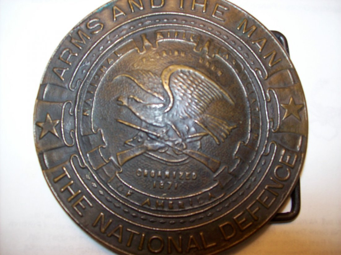 Vintage Tiffany Studios NRA National Defense Belt: I have up for Auction a Rare National Rifle association of America / The National defence Vintage Belt Buckle Made By Tiffany Studios. It is marked on the back: "TIFFANY STUDIO NEW YORK."3 inches Tall