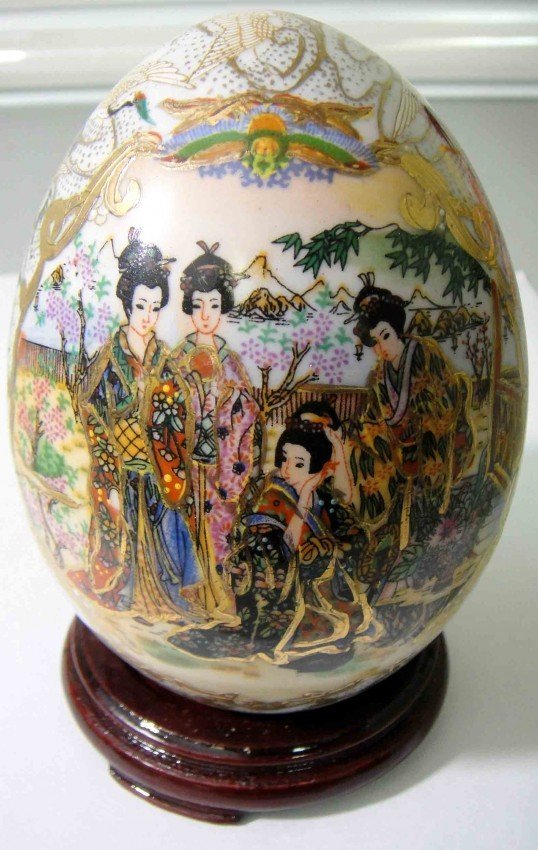 Chinese Porcelain Egg with Wooden Stand: Chinese Porcelain Egg with Wooden Stand. size: 5" Tall