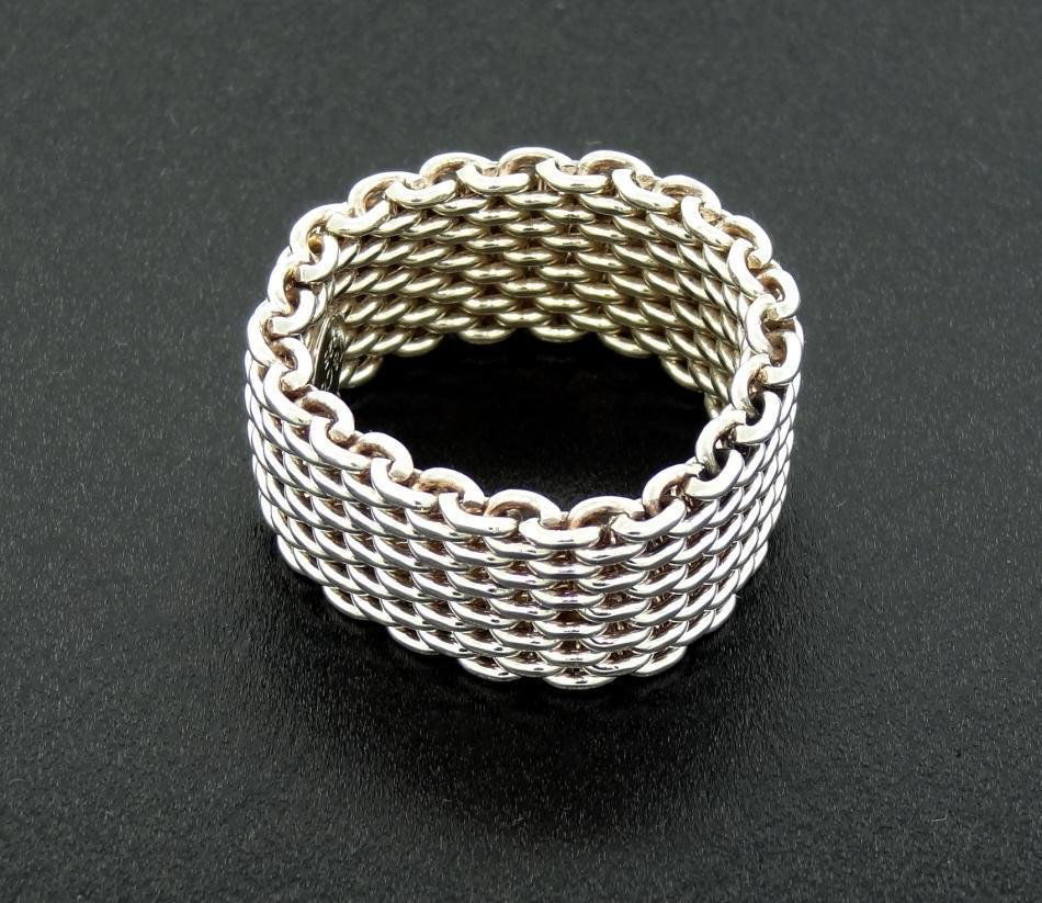 TIFFANY & Co. Somerset Flexible Band, Sterling Si: TIFFANY & Co. Somerset Flexible Band, Sterling Silver, Size 8 Offered on listing is previously owned fashionable band made by Tiffany & Co. Ring is made with meshed metal, which makes ring flexible.