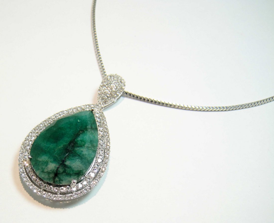 104.44ctw Green Beryl & CL Sapphire 925 Silver Pendant: Please review the attached gemologist report for further relevant Information.