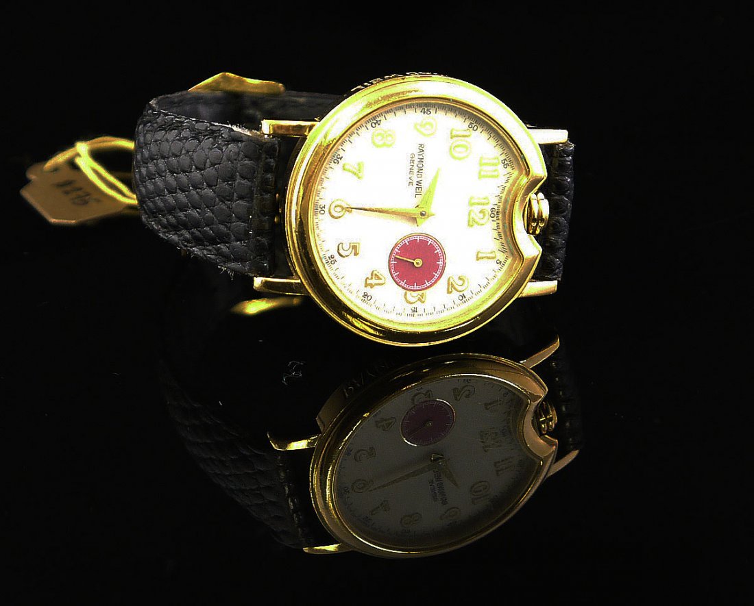 18K Electroplated Raymond Weil Watch: Raymond Weil Watch. Water Resistant. Patented Model 9820.18 K electroplated .10m Has some minor scrathes on the glass of the watch. cant be seen in the picture. w601