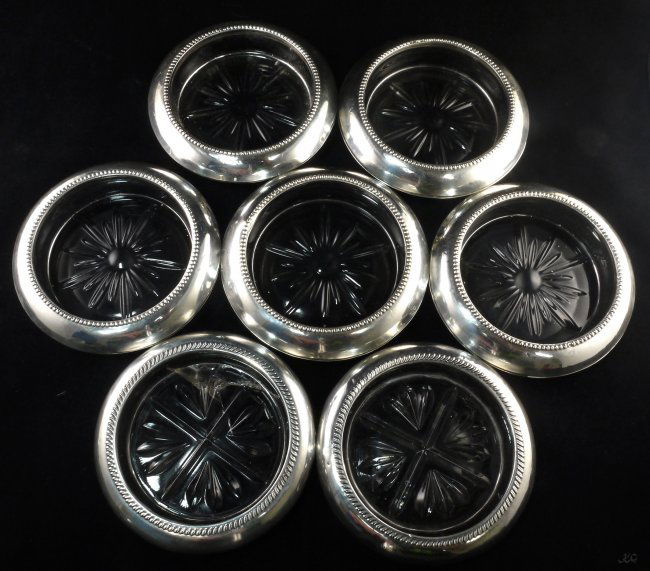 Antique Sterling Silver Coasters Set of 7 W248: Antique Sterling Silver Coasters Set of 7. One of the coasters has big cracked W248