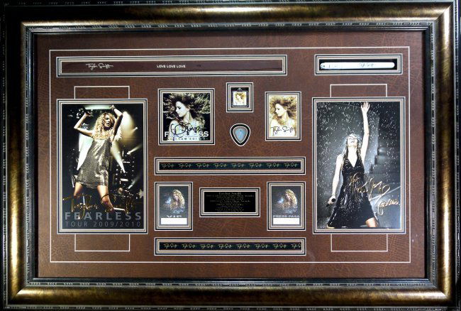Signed Taylor Swift Fearless(FRAMED) W2308: Signed Taylor Swift Fearless - Platinum Edition (FRAMED) frame size: 44.5" x 31" W2308