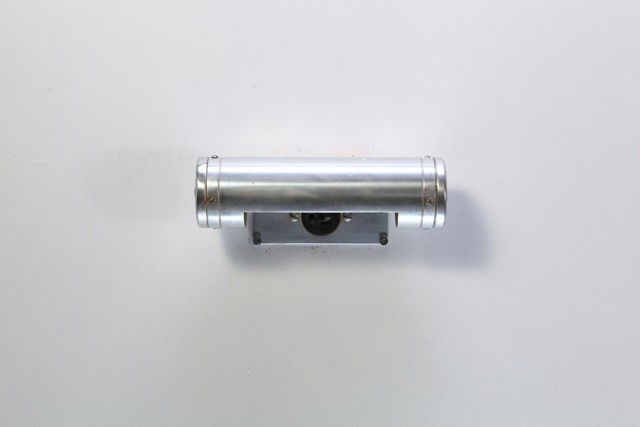 Gibbs and Cox - Flush Wall Mount Vanity Lamp: Designer: Gibbs and Cox Item: Flush Wall Mount Vanity Lamp Mfg.: The Simes Company Description: Surface wall mounted cylinder lalmp with electrical outlet Unit: 1 Dim. Exactly: (L x W x H"): 10