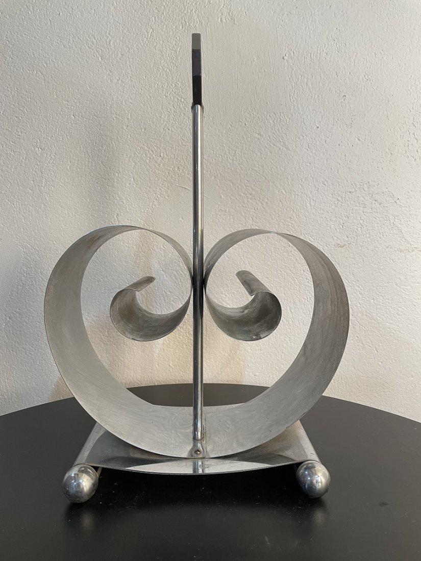 Art Deco Magazine Holder: Metal frame with a Bakelite handle. Measures: 18H x 8D x 11W