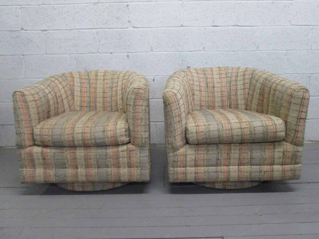 Pair Milo Baughman Style Swivel Chairs: Barrel back chairs with plaid upholstery. Will need reupholstering. Measures: 28"H x 30"H x 31"D