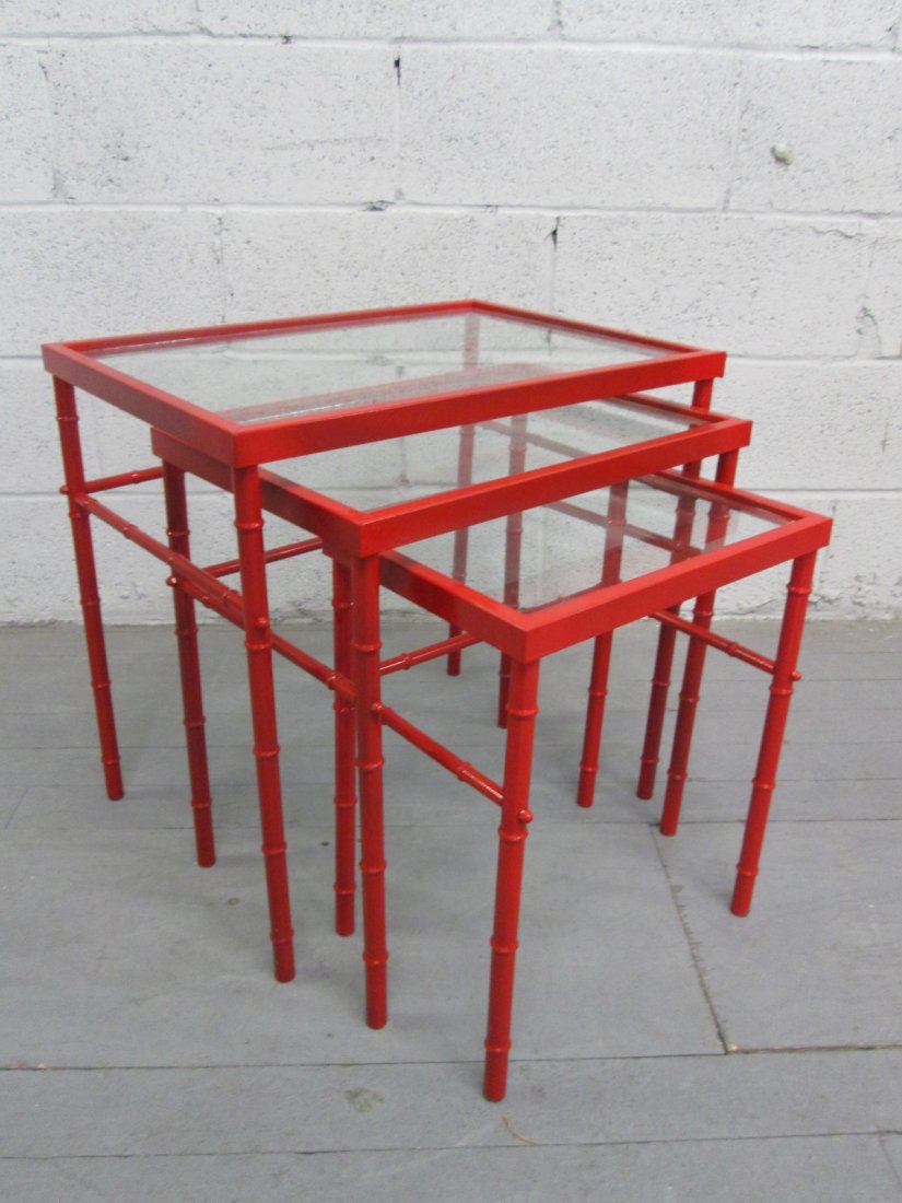 Asian Style Nest of Tables: Red lacquered metal frame with faux bamboo pattern and glass tops. Larger measures: 15.5"D x 21"H x 21.5"W