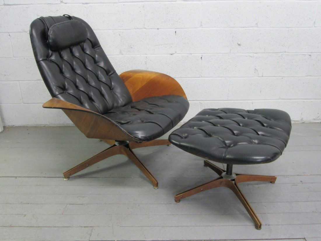 George Mulhauser Chair & Ottoman for Plycraft Labe: Plycraft chair & ottoman designed by George Mulhauser, with head pillow. Black vinyl with plywood frame. Chair, 32"D x 36"W x 37"H. Ottoman: 20"D x 24.5"W x 17"H