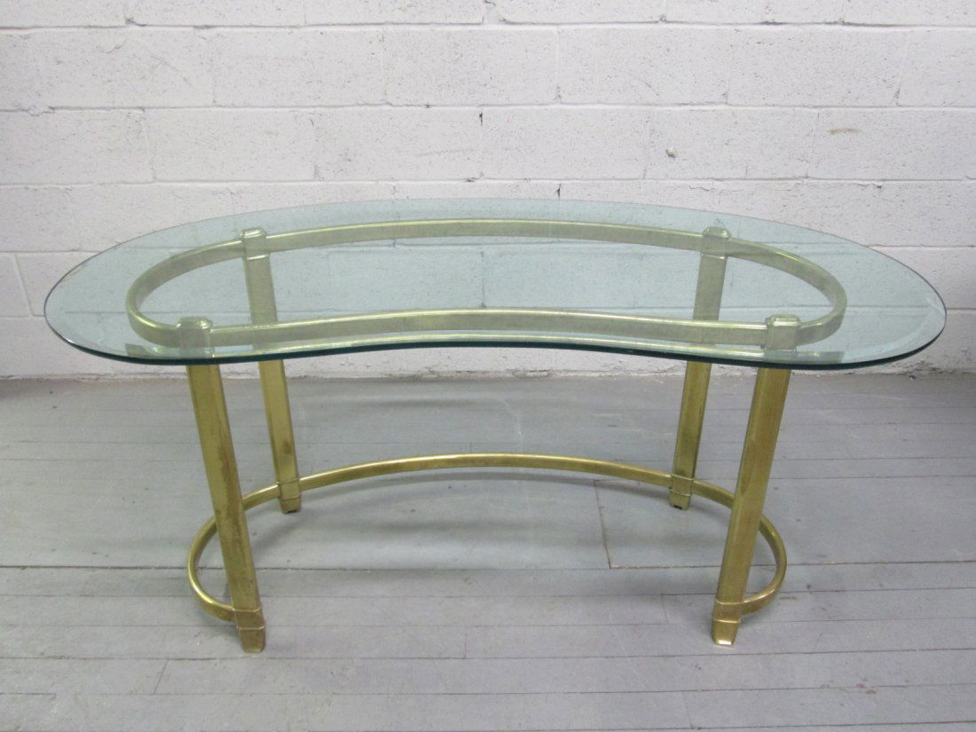 Mastercraft Style Brass Kidney Shaped Table: Kidney shaped, brass table with beveled glass. Measures: 60"W x 28.5"H x 27.5"D