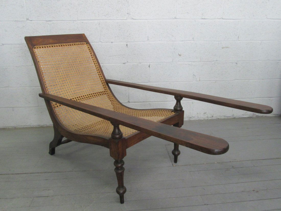 Antique Plantation Chair: Hand caned Plantation Chair with wood frame. Measures: 55"D x 6.25"W x 36"H