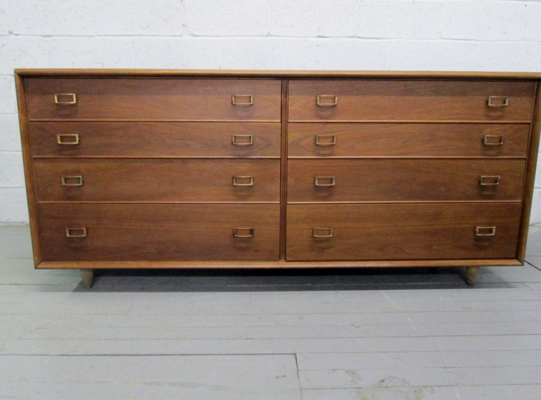 John Stuart Dresser: Walnut 8 drawer John Stuart dresser with brass handles. Measures: 72"W x 32"H x 22"D