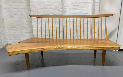 George Nakashima Studio Conoid Bench Signed Mira Nakashima, 1992: George Nakashima Studio Conoid bench signed Mira Nakashima 1992. The bench is walnut has hickory spindles and rosewood butterfly joints. This bench was commissioned for a private collector. Measures: