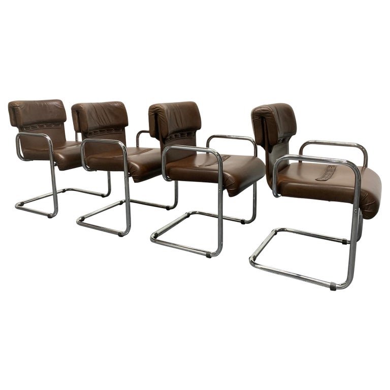 Guido Faleschini for Mariani Leather Chairs Set of 4: Four leather and chrome chairs designed by Guido Faleschini for Mariani, Pace collection.Brown leather and nicely hand stitched. Dining chairs. Labeled Mariani. Measures: 32H x 21.25W x 25D. Seat heig