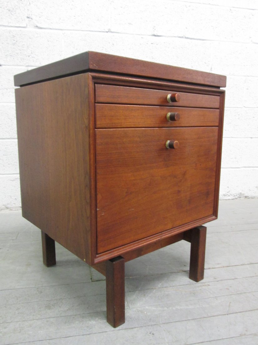 Jens Risom Side Table: Walnut side table with sliding tray and two pull out drawers. Measures: