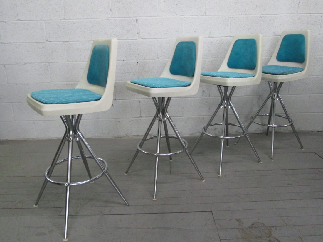 Mid Century Modern Swivel Bar Stools: Set of 4 bar stools with chrome frames. Vinyl backs and the seats are fabric. Measures: 43"H x 17"W x 18.25"D