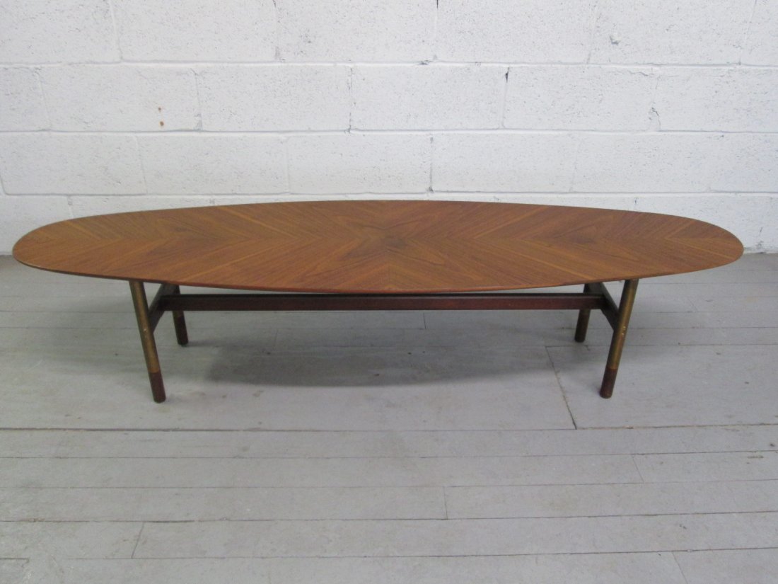 George Nelson for Herman Miller Coffee Table: Surfboard shaped top walnut table. The legs are walnut and metal. Measures: 14.5"H x 65"W x 18"D.
