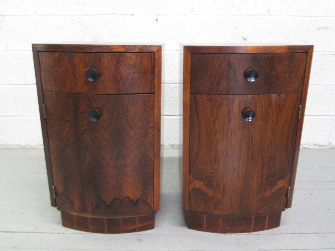 Gilbert Rohde Rosewood Nightstands Labeled: Pair Gilbert Rohde for Herman Miller nightstands. Has single pull out drawer and a cabinet door. Nice rosewood grain. One drawer has label. Measures: 16"W x 27"H x 13.5"D