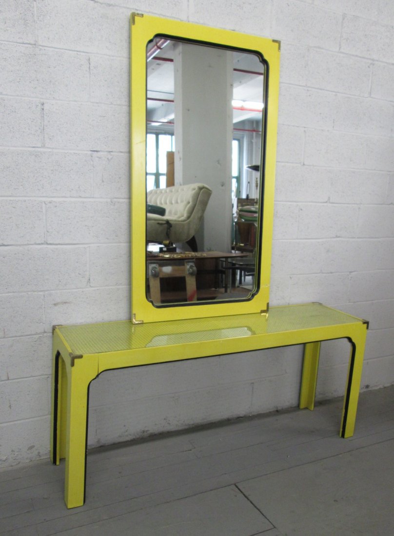 Mid Century Modern Console & Mirror: Wood with a yellow painted finish. Table has caned and glass top. Both table and mirror have decorative brass corners. Table, 60"W x 16"D x 26"H.