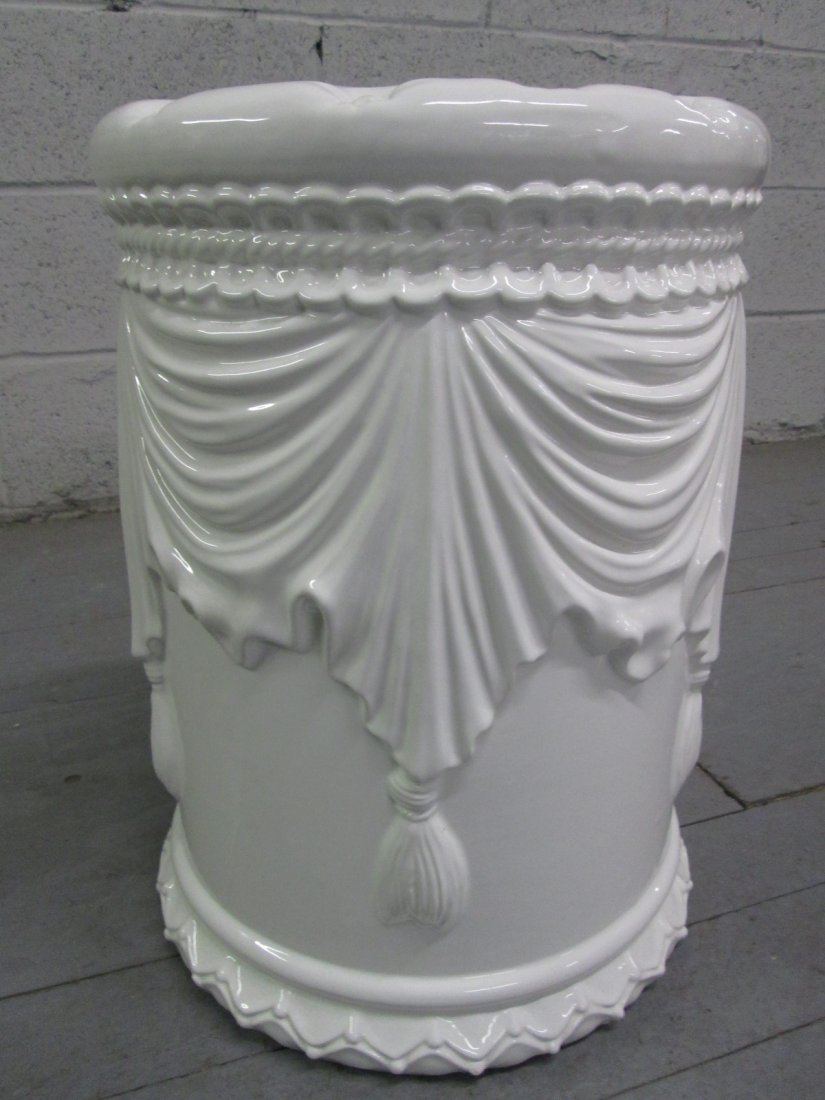 White Ceramic Garden Stool: 20th Century. White ceramic with a lovely decorative pattern throughout. Measures: 18"H 13" in diameter.