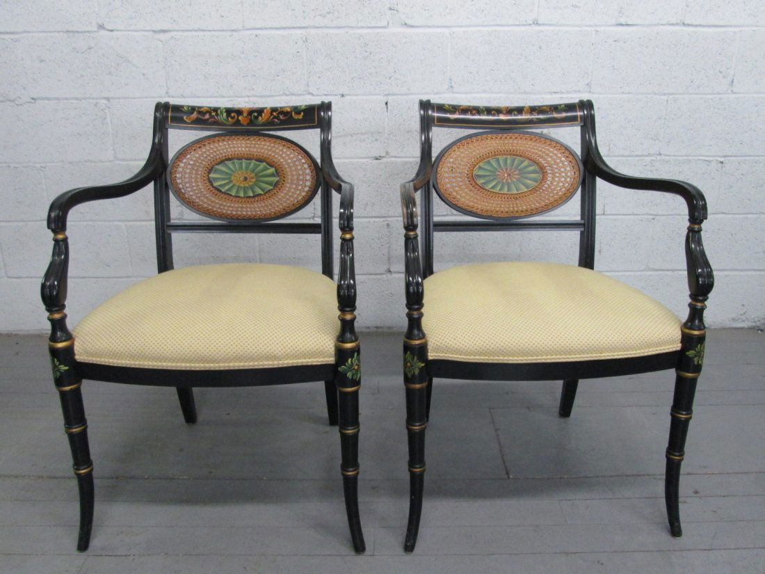 Pair Adams Style Arm Chairs w/ Stencil Frame: Black lacquered stencil frame with a caned back. Minor scratches. A few nicks. Measures: 32.5"W x 24.5"D x 33"H