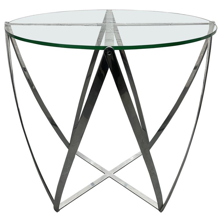 John Vesey Side Table: Polished aluminum and glass top side table. Measures: 28H x 29 in diameter.