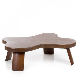 Paul Frankl Cork Coffee Table: Cork and mahogany coffee table by Paul Frankl for Johnson Furniture Co. Table has a biomorphic shape. Measures: 48W x 15H x 36D.