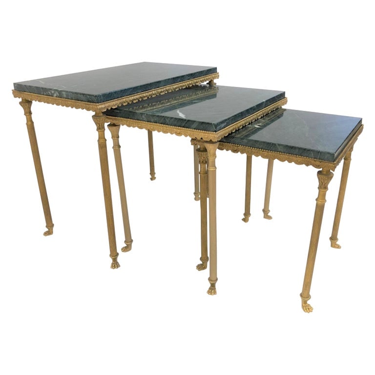 French Bronze and Marble Nesting Tables: Decorative bronze frame has columned style legs with feet. Green marble tops. Larger table measures: 17 H x 12 D x 19.75 W.