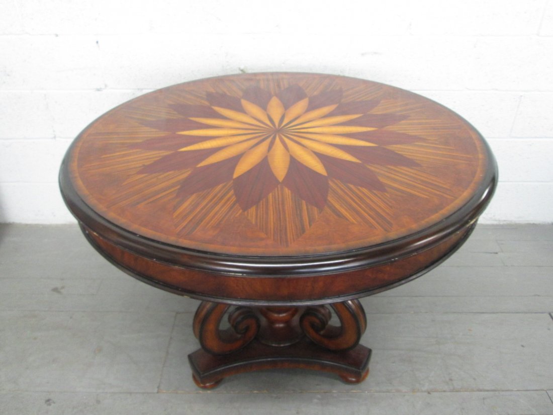 Maitland Smith Inlaid Center Table Labeled: Beautiful Maitland Smith table with a gorgeous inlaid top. Table is signed Maitland Smith with a sun dial design on top. Measures: 40" in diameter x 30.5"H