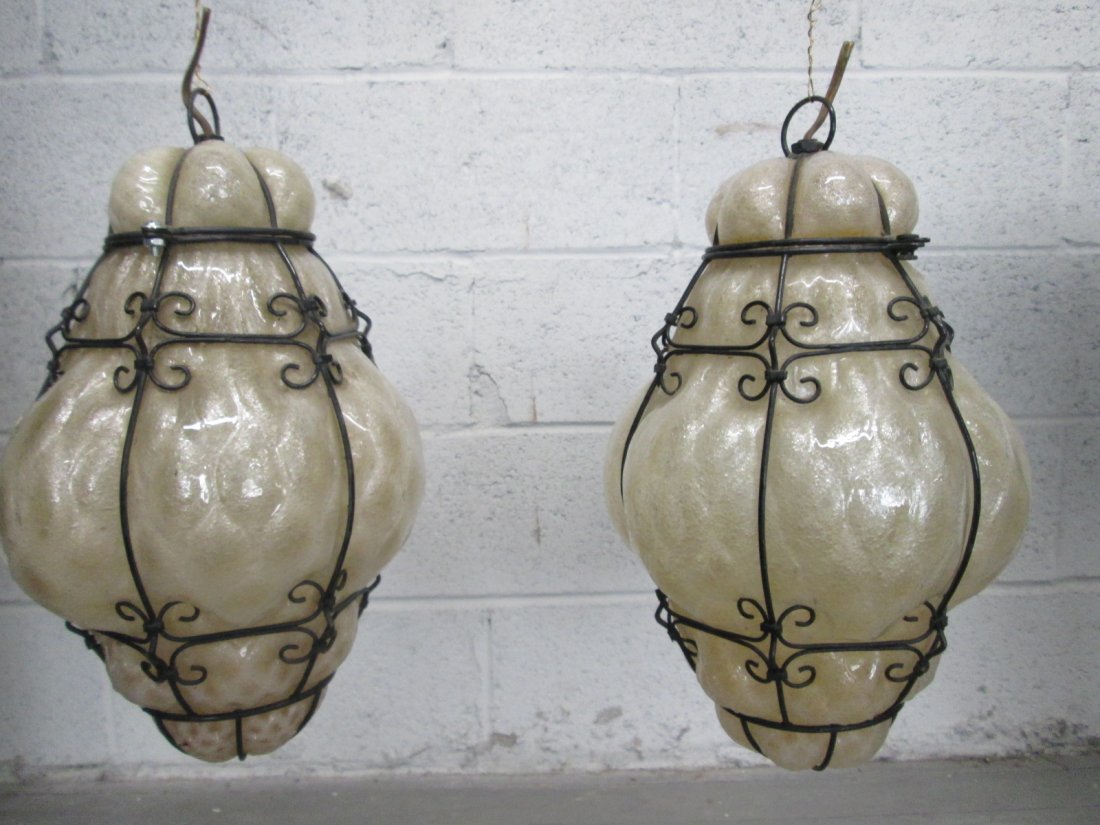 Pair Murano Light Fixtures: Has metal decorative frames. Measures: 12"H x 8"W (at it's widest)