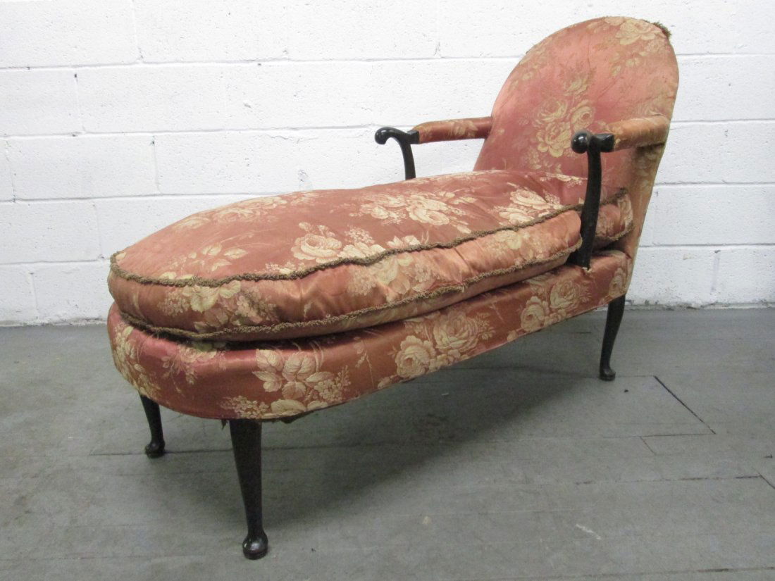 Antique Chaise Lounge: Antique day bed with a walnut frame, original fabric and has a down filled loose cushioned seat.Measures: 56.5"D x 26"W x 36"H.