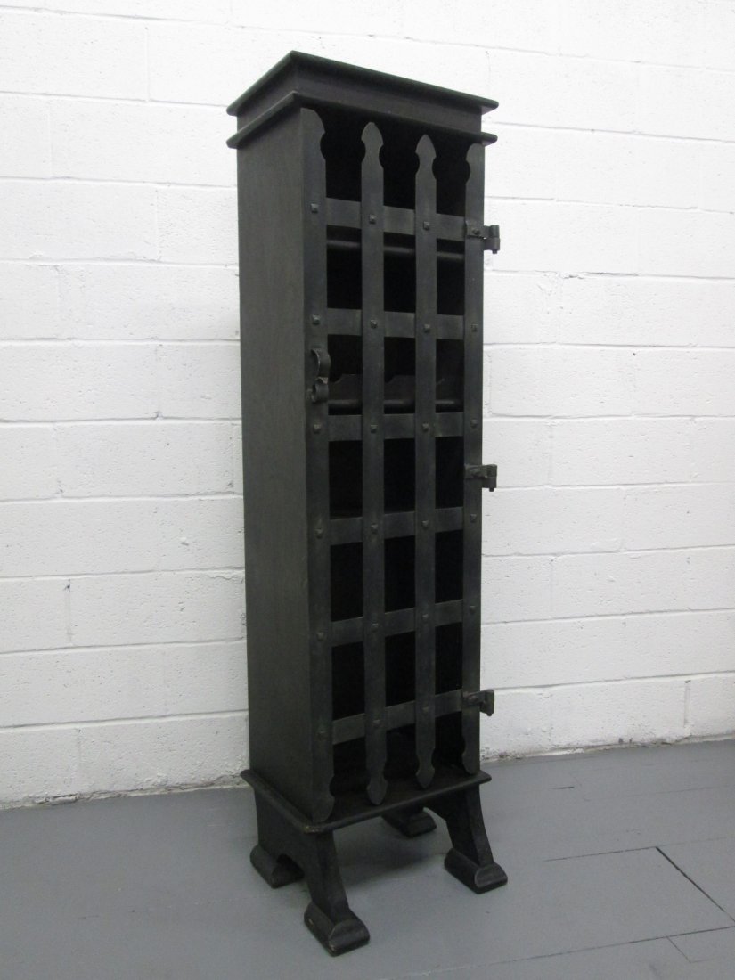 Gothic Style Wine Cabinet: Cabinet is oak with a dark finish and a steel door. First two top shelves are adjustable. Measures: 67.5"H x 20"W x 16"D