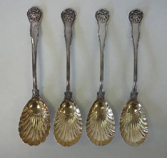 4 English Sterling Serving Spoons, Crested & Motto: A set of four English sterling silver long handled serving spoons in a Shell and Thread pattern, scalloped gold wash bowls. Three hallmarked for William Traies, London, 1829. The back of the handles c