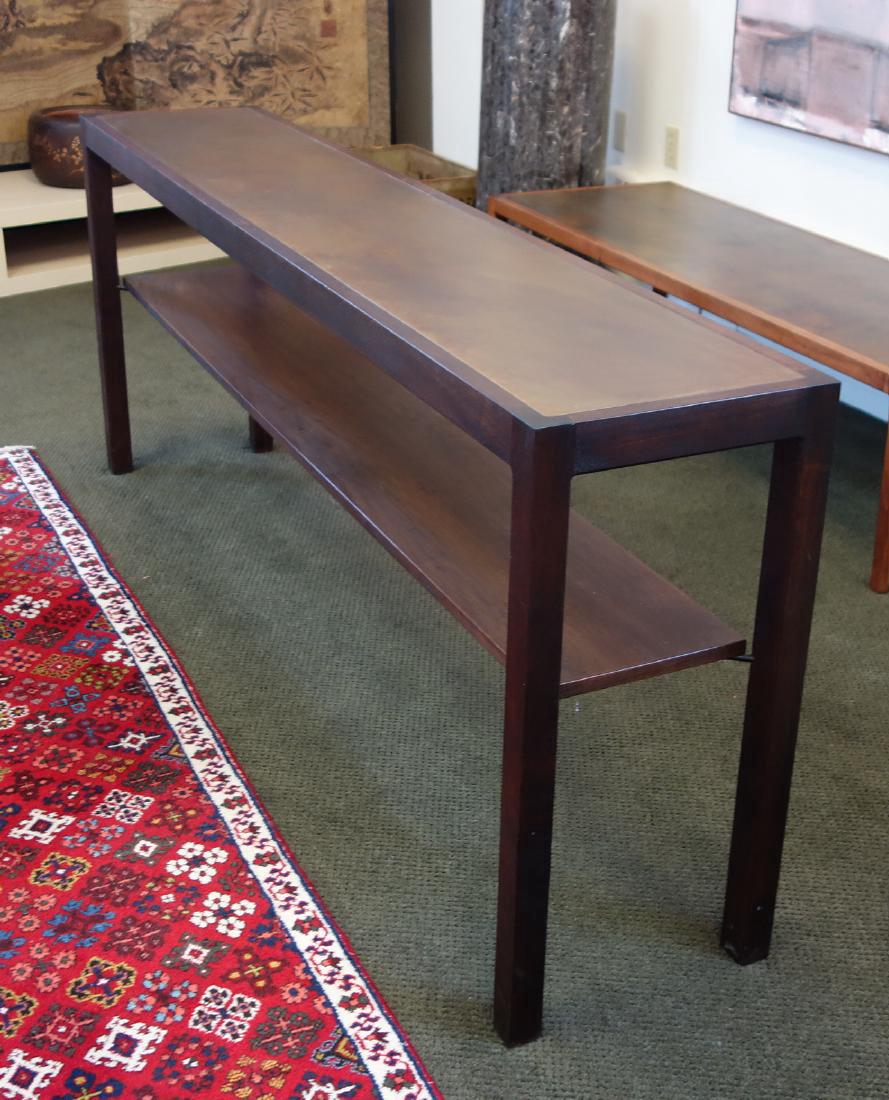 Harry Lunstead Two Tier Console Table: A Harry Lunstead two-tier console table. Dark walnut table, inset with the trademark acid-treated copper top. Measures 72" wide, 14" deep, 29" high. The lower shelf measures 68.25" long, 10.25" wide.