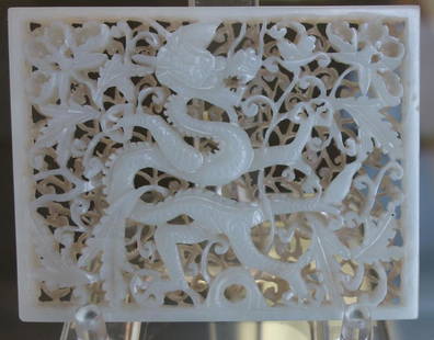 Ming Dynasty Carved White Jade 2-Layer Plaque: A very fine Chinese white nephrite jade double carved plaque, 16th century, Ming Dynasty. Elaborately carved 2-layer plaque depicting a dragon cavorting among leaves, vines, foliage and butterflies. M