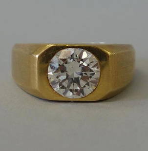 Men's 18K Gold & Diamond Ring, 2.56 Carats: A men's 18K yellow gold and diamond ring. The 18K gold (matte finish) ring is centered with a flush set round brilliant cut diamond of approximately 2.56 carats and measuring 9mm x 5.18mm. Clarity gra