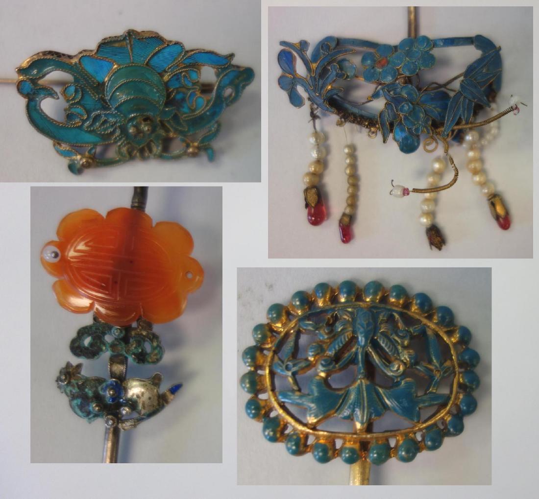 4 Chinese Kingfisher, Enamel & Carnelian Hairpins: Four Chinese hairpins. Comprised of two kingfisher feather and enamel hair pins. One formed as a bat within a gilt silver open-work filigree motif. The bat measures 1.5" wide, .75" high. Measures 3.25