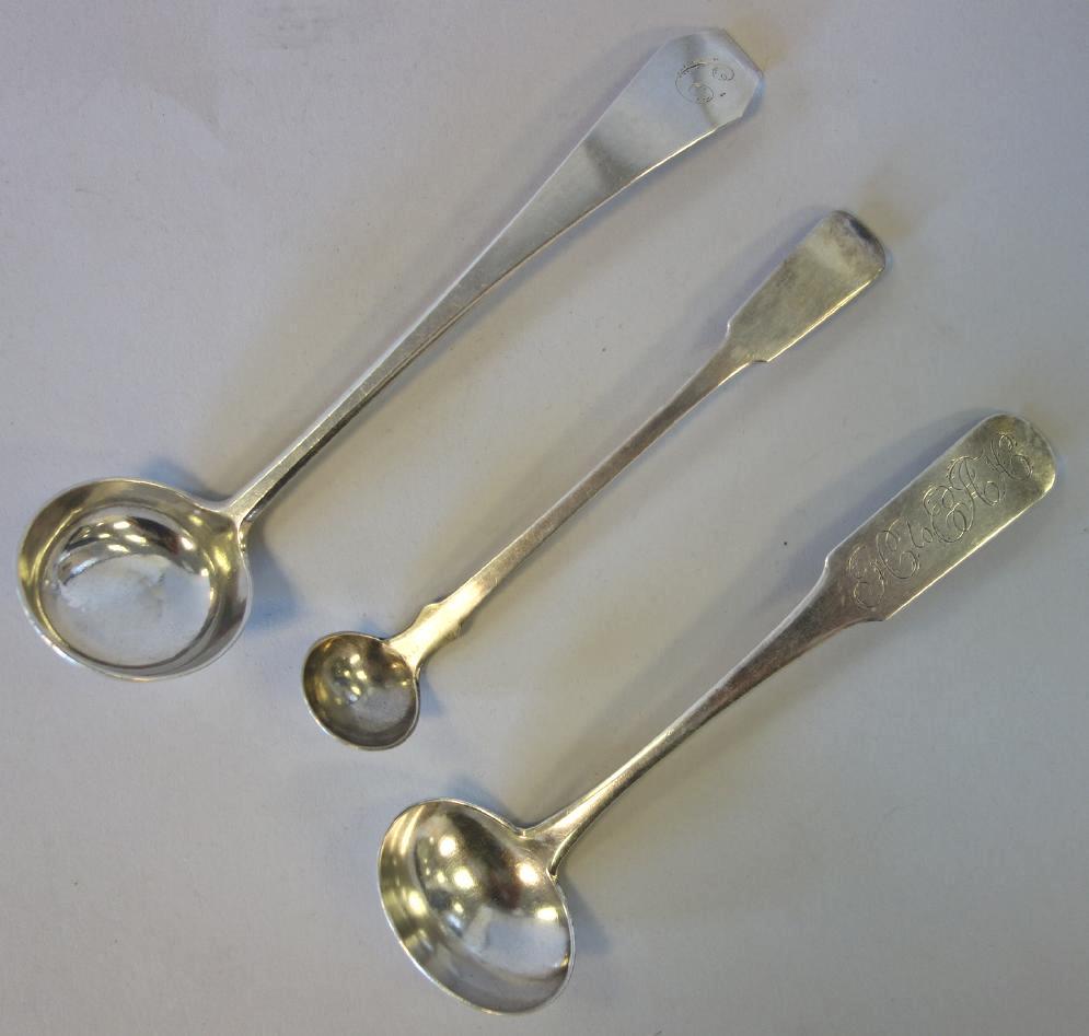 American Coin Silver Ladles, John Proctor Trott +: A group of three American coin silver sauce ladles. Comprised of a "coffin tip" ladle by John Proctor Trott (New London CT, active 1792-1820) 6" long. Together with a ladle by Daniel Booth Hempstead (