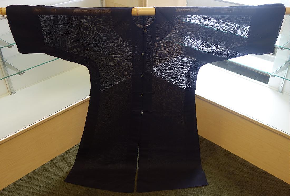 Chinese Blue Silk Gauze Surcoat, General Stilwell: A fine midnight blue silk gauze man's surcoat, Late Qing / Republic period. Woven with large roundels of dragons facing a flaming pearl, with enameled silver spherical buttons along the center front o