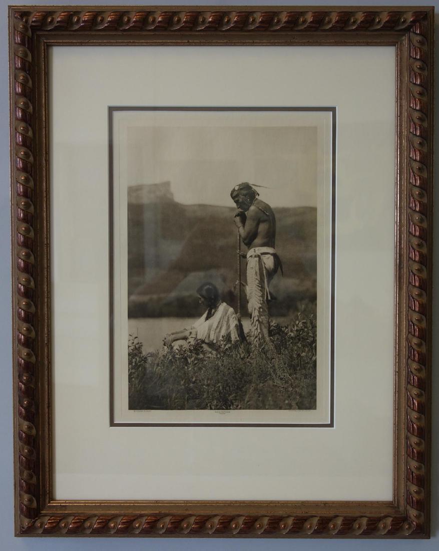 Roland W Reed (1864-1934) Meditation, Piegan: Framed vintage photogravure by Roland W. Reed (1864-1934). Titled Meditation, Piegan. Copyright, title and Gravure Eng. Co, Mpls., printed below the image. Sight measurement 13-5/8" x 9.5". Profession