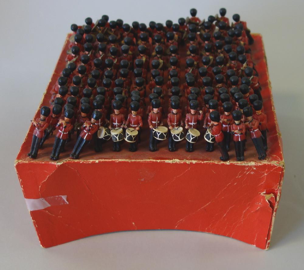 Vintage Toy Soldier Marching Band: A vintage toy soldier men's marching band. Made of plastic, possibly by Preiser Elastoin. The set consists of 136 soldiers, each with a musical instrument. The soldiers with peg-formed bases, rest in 