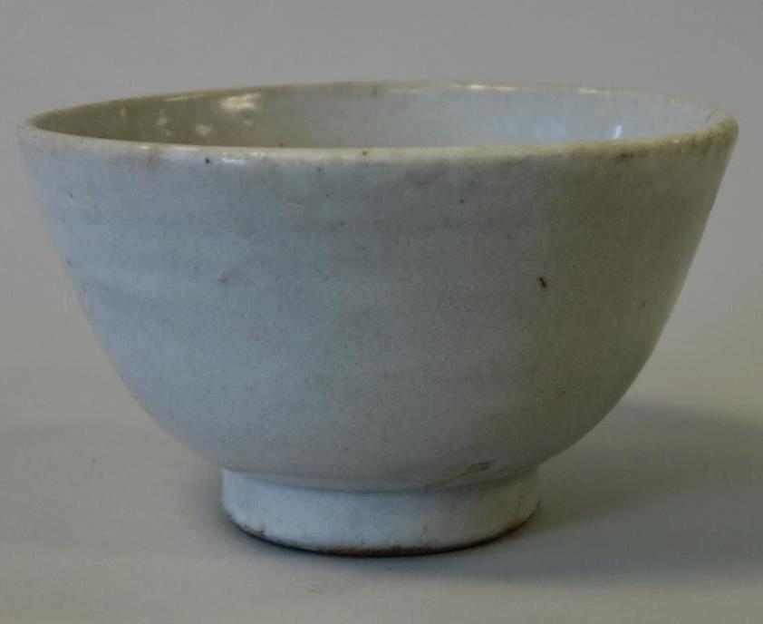 Korean White Porcelain Footed Bowl: A Korean white glazed porcelain footed bowl. White / gray glaze, the bowl measures 5-5/8" diameter, 3-3/8" high.