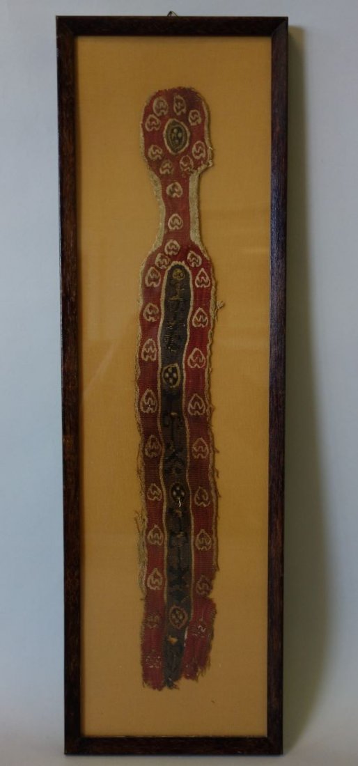 Ancient Coptic Textile Fragment, Egypt 4-7th AD: A framed ancient Egyptian Coptic textile fragment, Egypt, c.4-7th AD / CE. Wool on linen having a flower pattern on a brown and red field. Measures 16.75" x 2.25" wide. Mounted and framed under glass,