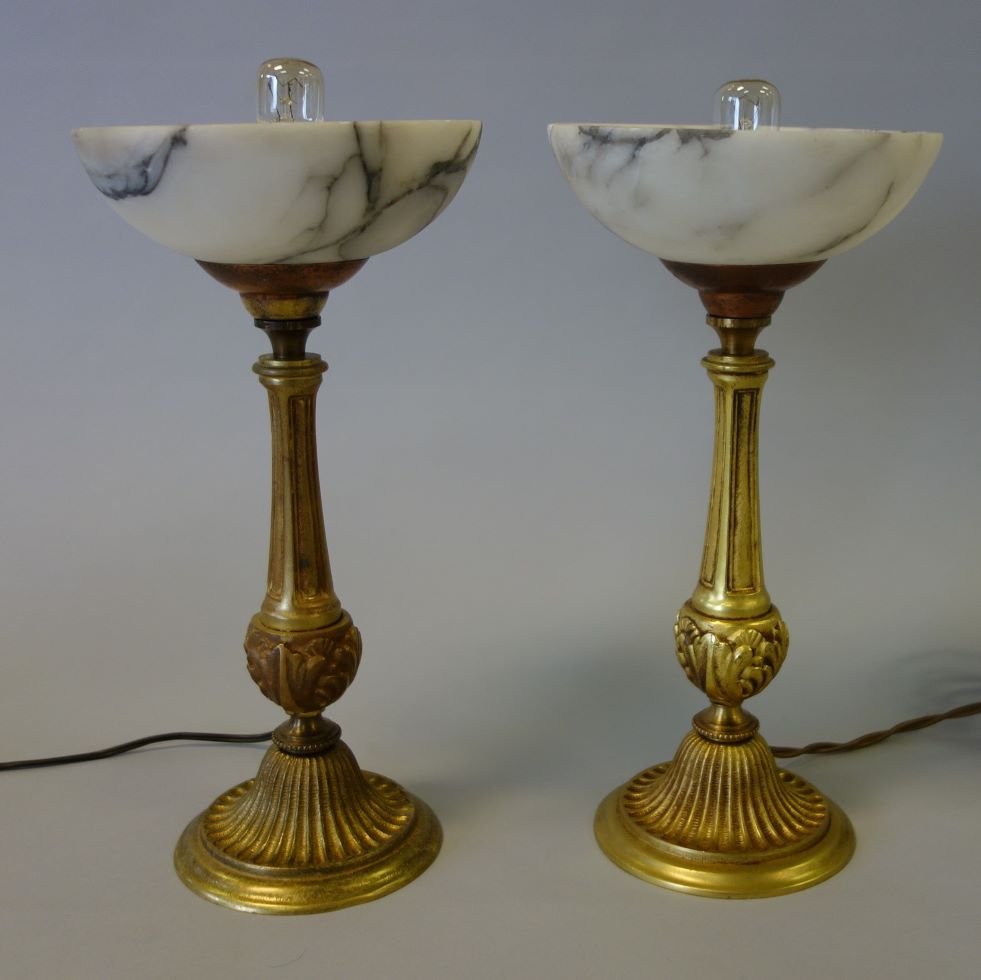 French Dore Bronze & Alabaster Lamps, Pair: A fine pair of dore / gilded bronze lamps with alabaster shades. Each measuring 11.25" high, 5.75" diameter shade. NOTE: both with 110 volt connecting plug, thus will need an adapter for USA electric.