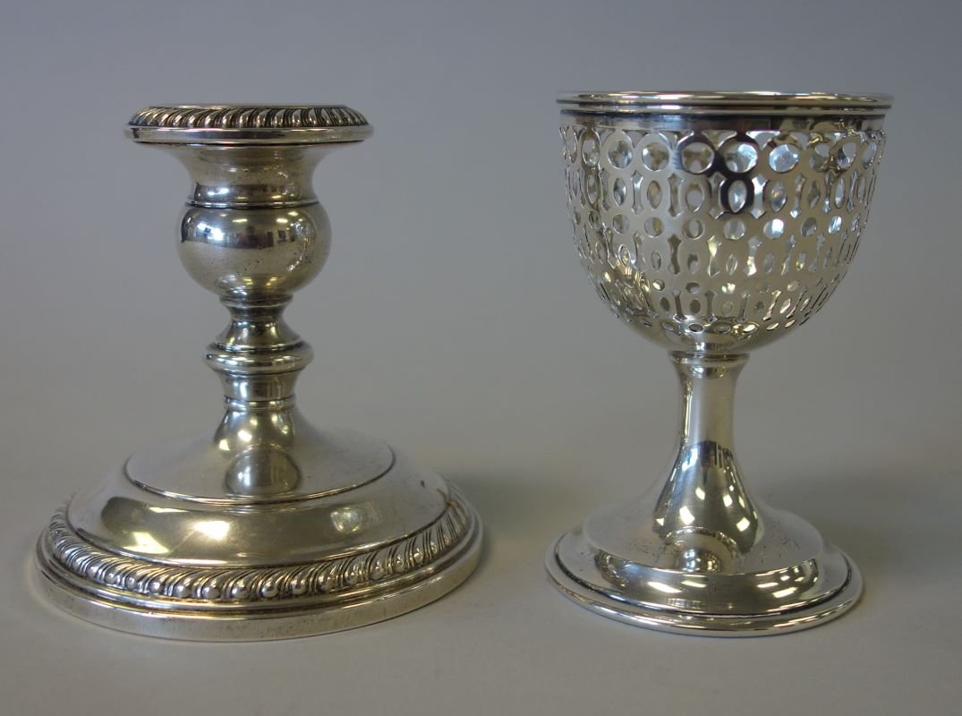 Reed & Barton Sterling Cup & Gorham Candleholder: A Reed & Barton sterling silver openwork chalice formed cup (missing glass insert). Pattern 1359, measures 4-1/8" high, 2.75" diameter. Engraved with initial monogram and 1904-1914. Together with a st