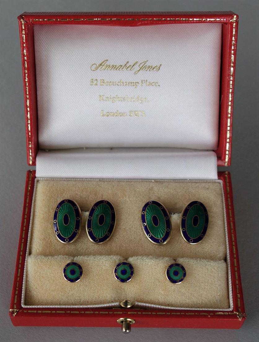 Deakin & Francis Guilloche Enamel Dress Set: Deakin & Francis dress set comprised of an oval pair of gilt sterling cufflinks with guilloche enamel centers and a cobalt blue enamel border, plus three shirt studs. Hallmarks for Birmingham, England