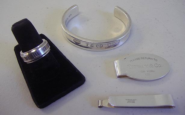 Tiffany Sterling Bracelet, Ring, Tie Bar & Clip: Tiffany & Co sterling bracelet in the 1837 pattern. Roman numeral ring in the Atlas pattern and a tie bar and money clip, all marked Tiffany & Co, sterling.