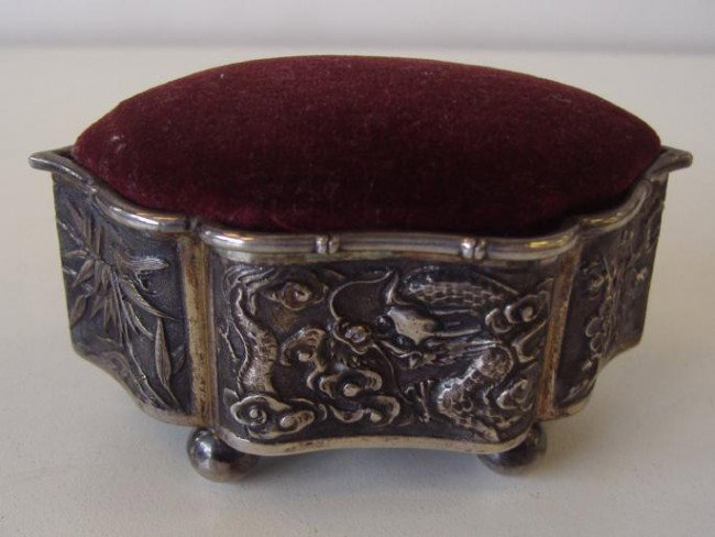 Chinese Export Silver Pin Cushion Box: Underside with Chinese Character marks and 90 within a square. Measures 3.25" long,1-7/8" wide and 1.5" high.