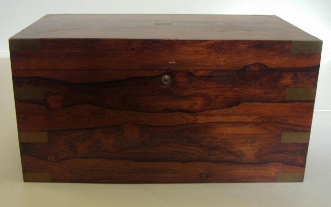 Large Bensen & Hedges Humidor, Brass Bound: Large rosewood veneered humidor box with removable metal lined interior with a Benson & Hedges label. Brass bound corners and brass handles. The lid has a brass monogram (GLD). The rare brahma lock wi