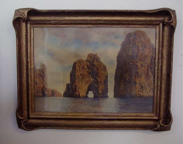 Campbell Art Company Print in a Pie Crust Frame: Campbell Art Company of Elizabeth NJ, print of ocean sea-stacks. In a bat-wing, pie crust frame. The overall framed measurement, 17" x 22".